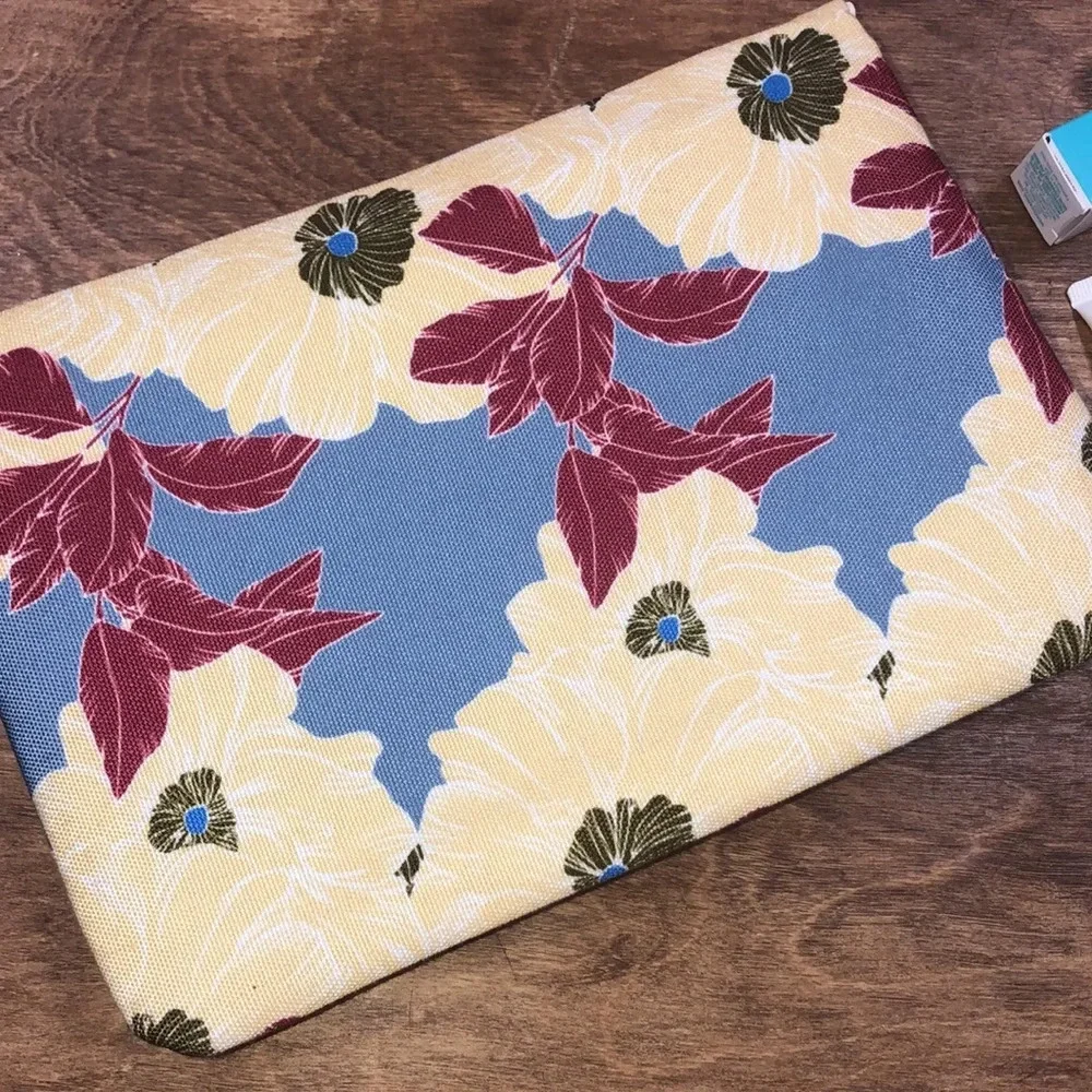 RACHEL Pally floral clutch with beauty samples